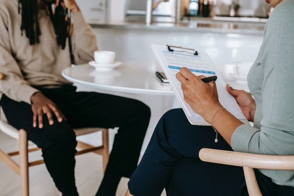 Job seeker and recruiter sitting together