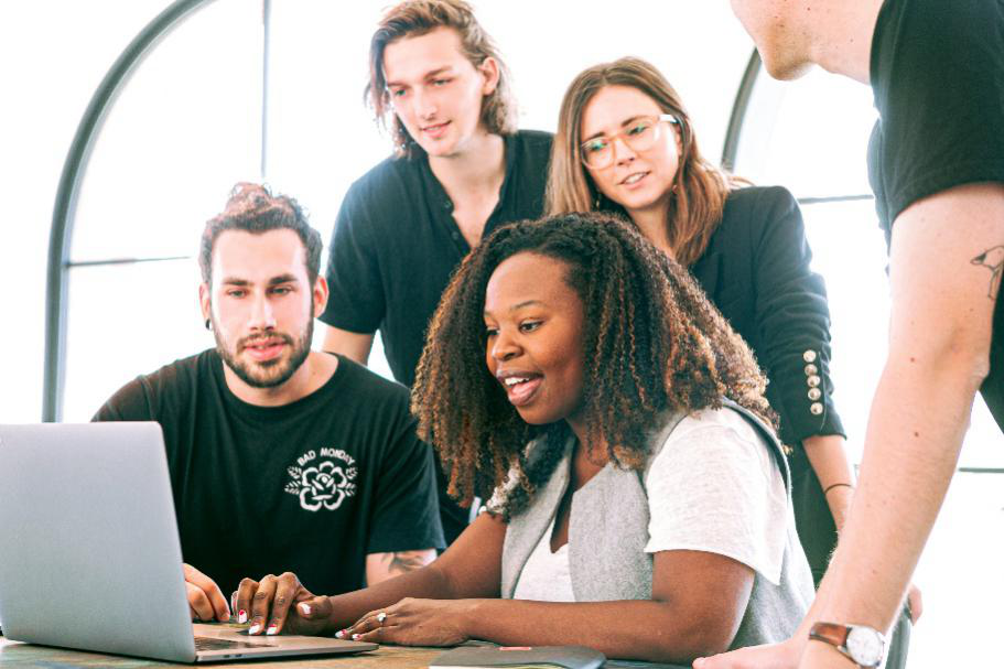 A team looking at a laptop