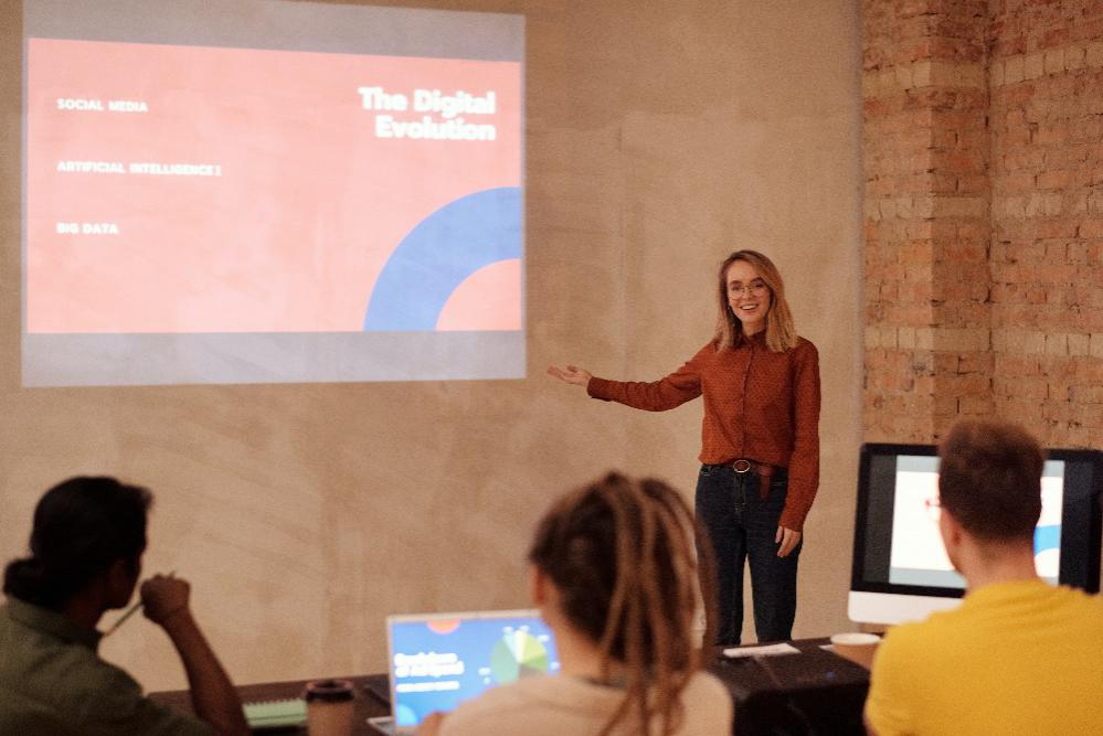 A woman giving a PowerPoint presentation