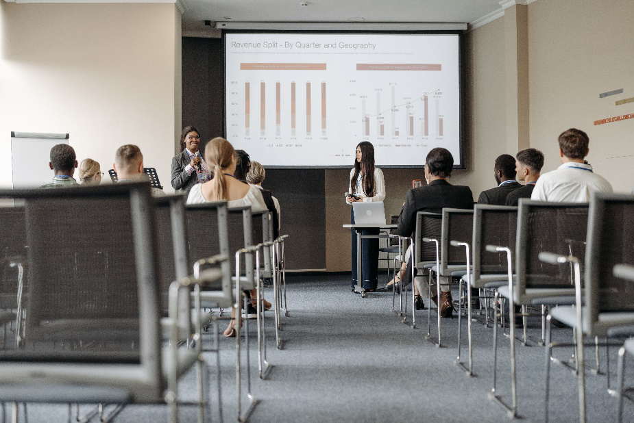 Two people giving a presentation in class